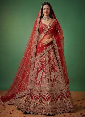 For A Fancy Designer Look,Grab These Lehenga Choli With 2 Dupatta in Fine Colored.These Lehenga And Choli Are Silk And Dupatta Are Fabricated On Net Pair.Its Beautified With Fancy Peacock Figure,Dori, Jari,Thread Embroidery,Diamond Work. 