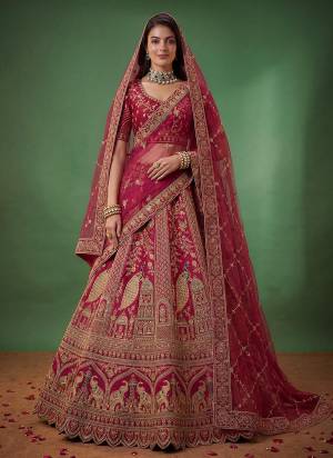 For A Fancy Designer Look,Grab These Lehenga Choli With 2 Dupatta in Fine Colored.These Lehenga And Choli Are Silk And Dupatta Are Fabricated On Net Pair.Its Beautified With Fancy Peacock Figure,Dori, Jari,Thread Embroidery,Diamond Work. 