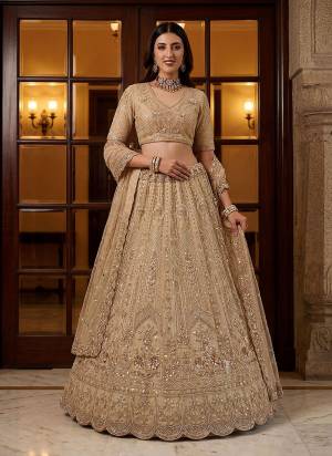 For A Fancy Designer Look,Grab These Lehenga Choli With Dupatta in Fine Colored.These Lehenga And Choli Are Net And Dupatta Are Fabricated On Net Pair.Its Beautified With Fancy Chapat Jari,Sequance,Multy Thread,Dori Embroidery,Zircon Diamond Work. 