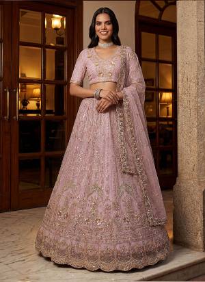 For A Fancy Designer Look,Grab These Lehenga Choli With Dupatta in Fine Colored.These Lehenga And Choli Are Net And Dupatta Are Fabricated On Net Pair.Its Beautified With Fancy Chapat Jari,Sequance,Multy Thread,Dori Embroidery,Zircon Diamond Work. 