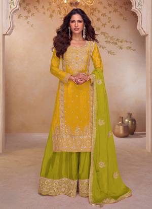 Yellow colored Palazzo Style suit is prettified with Embroidery work and Sequence Work as shown which makes it appear classy. This top is made of Chinon fabric which is accompanied with Chinon Bottom,Chinon dupatta and Santoon Inner. Women can buy this suit to wear for their parties and functions.