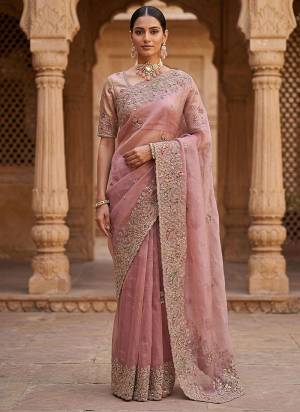 Attractive These Fastive And Wedding Party Wear Saree in Fine Colored.These Saree And Blouse is Fabricated On Gabana Silk.Its Beautified With Heavy Designer Peach,Dori,Multy Thread,Jari,Sequance Embroidery With Zircon Diamond Work.