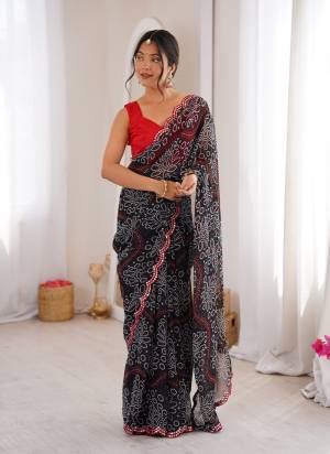 Attractive These Party Wear Saree in Fine Colored.These Saree Are Georgette And Blouse is Mono Banglori Fabricated.Its Beautified With Designer Bandhani Printed With Mirror Cut Work Border.