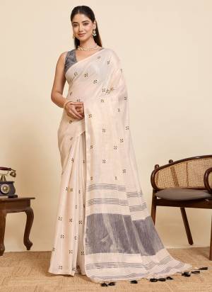 Garb This Party Wear Saree Paired With Blouse.This Saree And Blouse Are Linen Silk Fabric With Woven Pallu With Embroidery Work Designer. Buy This Pretty Saree Now.
