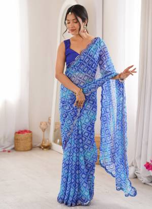 Garb These Party Wear Saree in Fine Colored.These Saree Are Georgette And Blouse is Mono Banglori Fabricated.Its Beautified With Designer Bandhani Jari Printed With Mirror Cut Work Border.