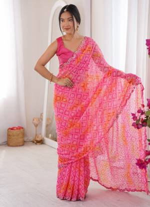 Garb These Party Wear Saree in Fine Colored.These Saree Are Georgette And Blouse is Mono Banglori Fabricated.Its Beautified With Designer Bandhani Jari Printed With Mirror Cut Work Border.