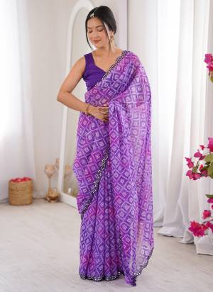 Garb These Party Wear Saree in Fine Colored.These Saree Are Georgette And Blouse is Mono Banglori Fabricated.Its Beautified With Designer Bandhani Jari Printed With Mirror Cut Work Border.