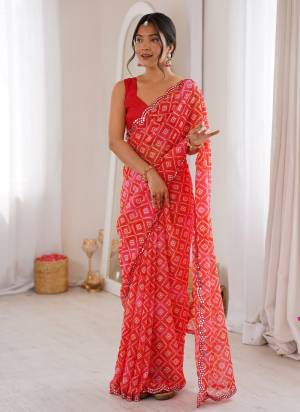 Garb These Party Wear Saree in Fine Colored.These Saree Are Georgette And Blouse is Mono Banglori Fabricated.Its Beautified With Designer Bandhani Jari Printed With Mirror Cut Work Border.