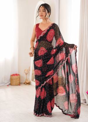 Looking These Party Wear Saree in Fine Colored.These Saree Are Georgette And Blouse is Mono Banglori Fabricated.Its Beautified With Designer Bandhani Gola Printed With Mirror Cut Work Border.