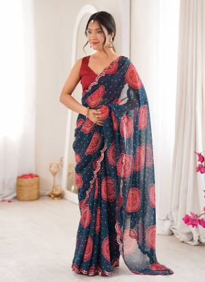 Looking These Party Wear Saree in Fine Colored.These Saree Are Georgette And Blouse is Mono Banglori Fabricated.Its Beautified With Designer Bandhani Gola Printed With Mirror Cut Work Border.