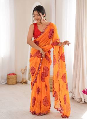 Looking These Party Wear Saree in Fine Colored.These Saree Are Georgette And Blouse is Mono Banglori Fabricated.Its Beautified With Designer Bandhani Gola Printed With Mirror Cut Work Border.