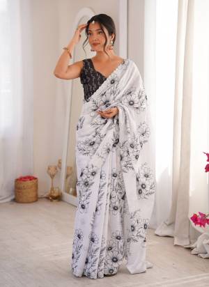 Garb These Party Wear Saree in Fine Colored.These Saree Are Chinon And Blouse is Chinon Fabricated.Its Beautified With Designer Digital Printed With Swarovski Cut Work Border.