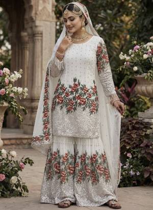 Attrective These Beautiful Looking Readymade Sharara Suits.These Top And Bottom is Fabricated On Fendy Silk And Fendy Silk Dupatta.Its Beautified With Designer Multy Thread,Sequance Embroidery Work .