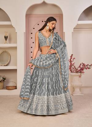 For A Different Look,Grab These Party Wear Designer Lehenga in All Over Pretty Colored Pair With Blouse And Dupatta.These Lehenga Choli And Dupatta is All Over Butterfly Net Base Fabric With Designer Cotton Thread, Sandwitch Sequance Embroidery Work.