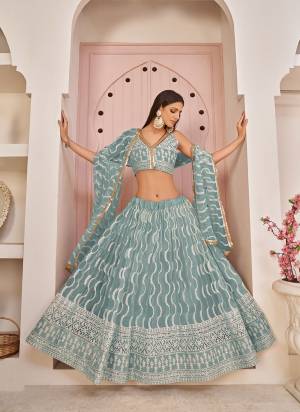 For A Different Look,Grab These Party Wear Designer Lehenga in All Over Pretty Colored Pair With Blouse And Dupatta.These Lehenga Choli And Dupatta is All Over Butterfly Net Base Fabric With Designer Cotton Thread, Sandwitch Sequance Embroidery Work.