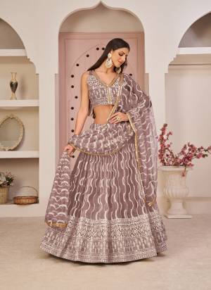 For A Different Look,Grab These Party Wear Designer Lehenga in All Over Pretty Colored Pair With Blouse And Dupatta.These Lehenga Choli And Dupatta is All Over Butterfly Net Base Fabric With Designer Cotton Thread, Sandwitch Sequance Embroidery Work.