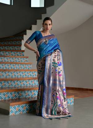 Garb These Festive And Party Wear Saree in Fine Colored.These Saree And Blouse is Fabricated On Banarasi Silk.Its Beautified With Traditional Paithani Meenakari Woven Designer.