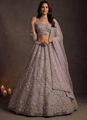 For A Fancy Designer Look,Grab These Lehenga Choli With Dupatta in Fine Colored.These Lehenga And Choli Are Net And Dupatta Are Fabricated On Soft Net Pair.Its Beautified With Fancy Jari,Sequance,Multy Thread,Dori Embroidery Work. 
