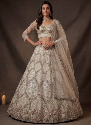For A Fancy Designer Look,Grab These Lehenga Choli With Dupatta in Fine Colored.These Lehenga And Choli Are Net And Dupatta Are Fabricated On Soft Net Pair.Its Beautified With Fancy Jari,Sequance,Multy Thread,Dori Embroidery Work. 
