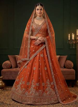 For A Fancy Designer Look,Grab These Lehenga Choli With 2 Dupatta in Fine Colored.These Lehenga And Choli Are Gadhwal Silk And Dupatta Are Fabricated On Net Pair.Its Beautified With Fancy Jari,Sequance,Dori Embroidery,Beads Work. 