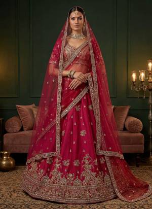 For A Fancy Designer Look,Grab These Lehenga Choli With 2 Dupatta in Fine Colored.These Lehenga And Choli Are Gadhwal Silk And Dupatta Are Fabricated On Net Pair.Its Beautified With Fancy Jari,Sequance,Dori Embroidery,Beads Work. 