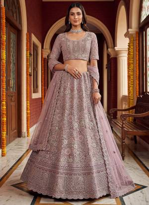 For A Fancy Designer Look,Grab These Lehenga Choli With Dupatta in Fine Colored.These Lehenga And Choli Are Net And Dupatta Are Fabricated On Soft Net Pair.Its Beautified With Fancy Chapat Jari,Sequance,Multy Thread,Dori Embroidery,Zircon Diamond Work. 