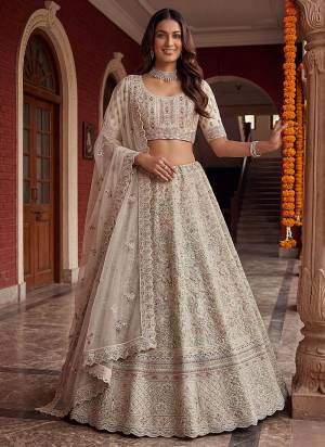 For A Fancy Designer Look,Grab These Lehenga Choli With Dupatta in Fine Colored.These Lehenga And Choli Are Net And Dupatta Are Fabricated On Soft Net Pair.Its Beautified With Fancy Chapat Jari,Sequance,Multy Thread,Dori Embroidery,Zircon Diamond Work. 