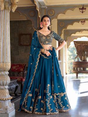 For A Designer Look,Grab These Lehenga Choli in Fine Colored.These Lehenga And Dupatta Are Fabricated On Rangoli Silk Pair With Rangoli Silk Blouse.Its Beautified With Designer Dori,Sequance,Jari Embroidery Work.