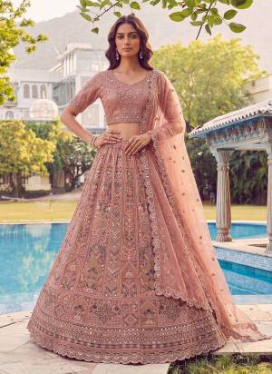 For A Fancy Designer Look,Grab These Lehenga Choli With Dupatta in Fine Colored.These Lehenga And Choli Are Net And Dupatta Are Fabricated On Soft Net Pair.Its Beautified With Fancy Jari,Sequance,Dori,Multy Thread Embroidery,Zircon Diamond Work. 