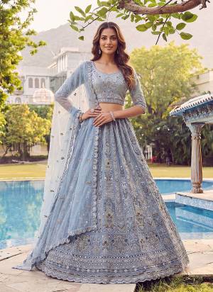 For A Fancy Designer Look,Grab These Lehenga Choli With Dupatta in Fine Colored.These Lehenga And Choli Are Net And Dupatta Are Fabricated On Soft Net Pair.Its Beautified With Fancy Jari,Sequance,Dori,Multy Thread Embroidery,Zircon Diamond Work. 