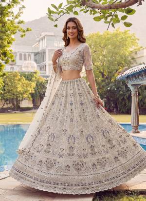 For A Fancy Designer Look,Grab These Lehenga Choli With Dupatta in Fine Colored.These Lehenga And Choli Are Net And Dupatta Are Fabricated On Soft Net Pair.Its Beautified With Fancy Jari,Sequance,Dori,Multy Thread Embroidery,Zircon Diamond Work. 