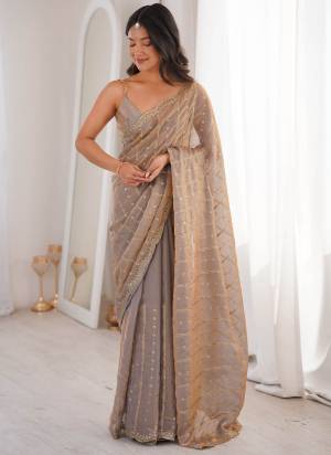 Garb These Fancy Party Wear Saree in Fine Colored.These Saree Are Fendy Satin And Blouse is Fendy Satin Fabricated.Its Beautified With Sequance Embroidery Work.