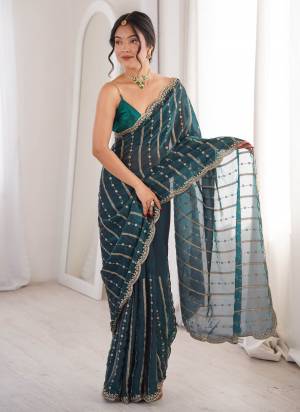 Garb These Fancy Party Wear Saree in Fine Colored.These Saree Are Fendy Satin And Blouse is Fendy Satin Fabricated.Its Beautified With Sequance Embroidery Work.