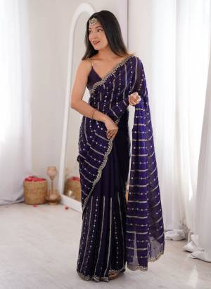 Garb These Fancy Party Wear Saree in Fine Colored.These Saree Are Fendy Satin And Blouse is Fendy Satin Fabricated.Its Beautified With Sequance Embroidery Work.