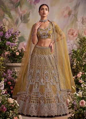 For A Fancy Designer Look,Grab These Lehenga Choli With Dupatta in Fine Colored.These Lehenga And Choli Are Net And Dupatta Are Fabricated On Soft Net Pair.Its Beautified With Fancy Jari,Sequance,Dori,Multy Thread Embroidery Work. 
