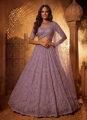 For A Fancy Designer Look,Grab These Lehenga Choli With Dupatta in Fine Colored.These Lehenga And Choli Are Net And Dupatta Are Fabricated On Soft Net Pair.Its Beautified With Fancy Patten,Intricate Boota,Sequance Embroidery,Motif Crystal Work. 