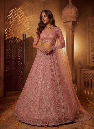 For A Fancy Designer Look,Grab These Lehenga Choli With Dupatta in Fine Colored.These Lehenga And Choli Are Net And Dupatta Are Fabricated On Soft Net Pair.Its Beautified With Fancy Patten,Intricate Boota,Sequance Embroidery,Motif Crystal Work. 
