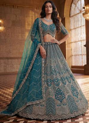 For A Fancy Designer Look,Grab These Lehenga Choli With Dupatta in Fine Colored.These Lehenga And Choli Are Net And Dupatta Are Fabricated On Soft Net Pair.Its Beautified With Fancy Patten,Intricate Boota,Sequance Embroidery,Motif Crystal Work. 