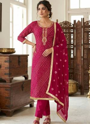 Garb These Suit in Fine Colored Pair With Bottom And Dupatta.These Top Are Jam Cotton And Dupatta Are Fabricated On Naznin Pair With Cotton Bottom.Its Beautified With Designer Bandhani Printed, Embroidery Work.