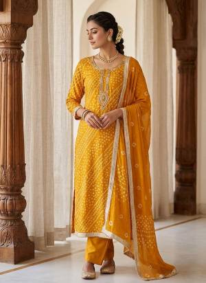 Garb These Suit in Fine Colored Pair With Bottom And Dupatta.These Top Are Jam Cotton And Dupatta Are Fabricated On Naznin Pair With Cotton Bottom.Its Beautified With Designer Bandhani Printed, Embroidery Work.