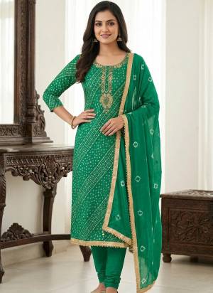 Garb These Suit in Fine Colored Pair With Bottom And Dupatta.These Top Are Jam Cotton And Dupatta Are Fabricated On Naznin Pair With Cotton Bottom.Its Beautified With Designer Bandhani Printed, Embroidery Work.