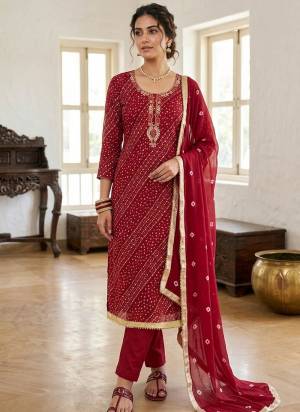 Garb These Suit in Fine Colored Pair With Bottom And Dupatta.These Top Are Jam Cotton And Dupatta Are Fabricated On Naznin Pair With Cotton Bottom.Its Beautified With Designer Bandhani Printed, Embroidery Work.