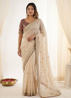 Looking These Party Wear Saree in Fine Colored.These Saree Are Rangoli Silk And Blouse is Fabricated On Rangoli Silk.Its Beautified With Designer Sequance,Jari Embroidery Work.