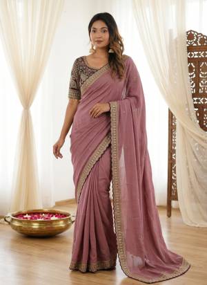 Looking These Party Wear Saree in Fine Colored.These Saree Are Rangoli Silk And Blouse is Fabricated On Rangoli Silk.Its Beautified With Designer Sequance,Jari Embroidery Work.