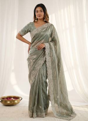 Garb These Party Wear Saree in Fine Colored.These Saree Are Fendy Satin And Blouse is Fabricated On Fendy Satin.Its Beautified With Designer C Pallu Dori Embroidery Work.