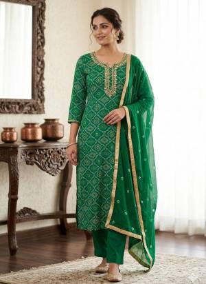 Looking These Suit in Fine Colored Pair With Bottom And Dupatta.These Top Are Jam Cotton And Dupatta Are Fabricated On Naznin Pair With Cotton Bottom.Its Beautified With Bandhani Printed Designer,Embroidery Work.