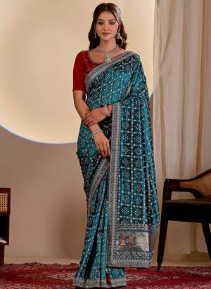 Garb This Party Wear Saree Paired With Blouse.This Saree Are Vichitra Silk And Blouse Are Banglori Silk Fabric With Designer Teble Printed Bandhani With Thread,Sequance Embroidery,Diamond Work. Buy This Pretty Saree Now.
