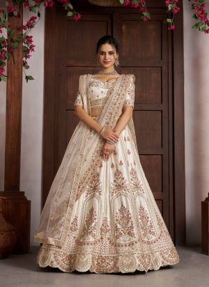 For A Designer Look,Grab These Lehenga Choli in Fine Colored.These Lehenga And Choli Are Fabricated On Silk Pair With Soft Net Dupatta.Its Beautified With Designer Embroidery,Hand Work.