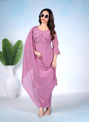 Garb These Suit in Fine Colored Pair With Bottom And Dupatta.These Top Are Mul Cotton And Bottom Are Fabricated On Roman Silk Pair With Mul Cotton Dupatta.Its Beautified With Designer Embroidery Work.