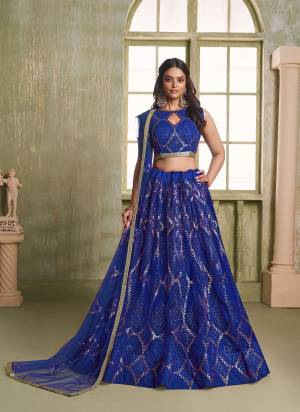 For A Different Look,Grab These Party Wear Designer Lehenga in All Over Pretty Colored Pair With Blouse And Dupatta.These Lehenga Choli And Dupatta is All Over Butterfly Net Base Fabric With Designer Tone To Tone Thread,Glitter Sequance Embroidery Work.